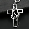 Silver pendant featuring a cross with praying hands design.