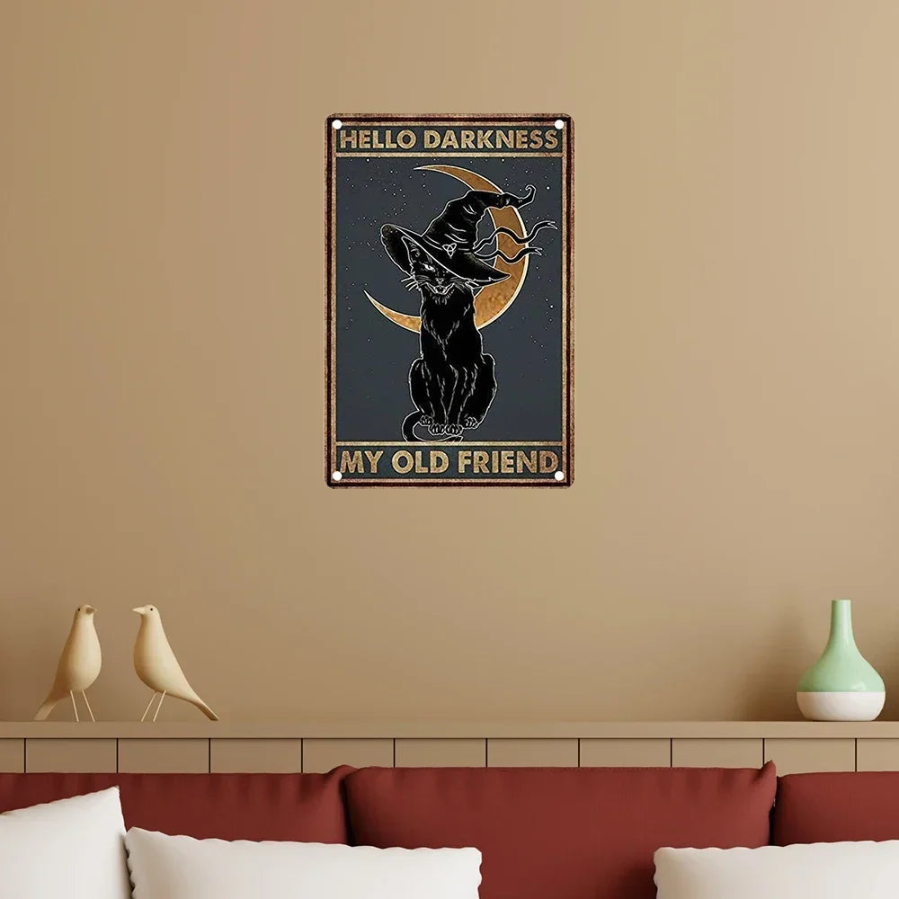 A vintage metal sign featuring a silhouette of a witch and a cat against a moon, with the text Hello Darkness My Old Friend.