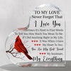 A clear heart-shaped acrylic plaque engraved with a red bird design and the message I love you sometimes it's hard to find wo