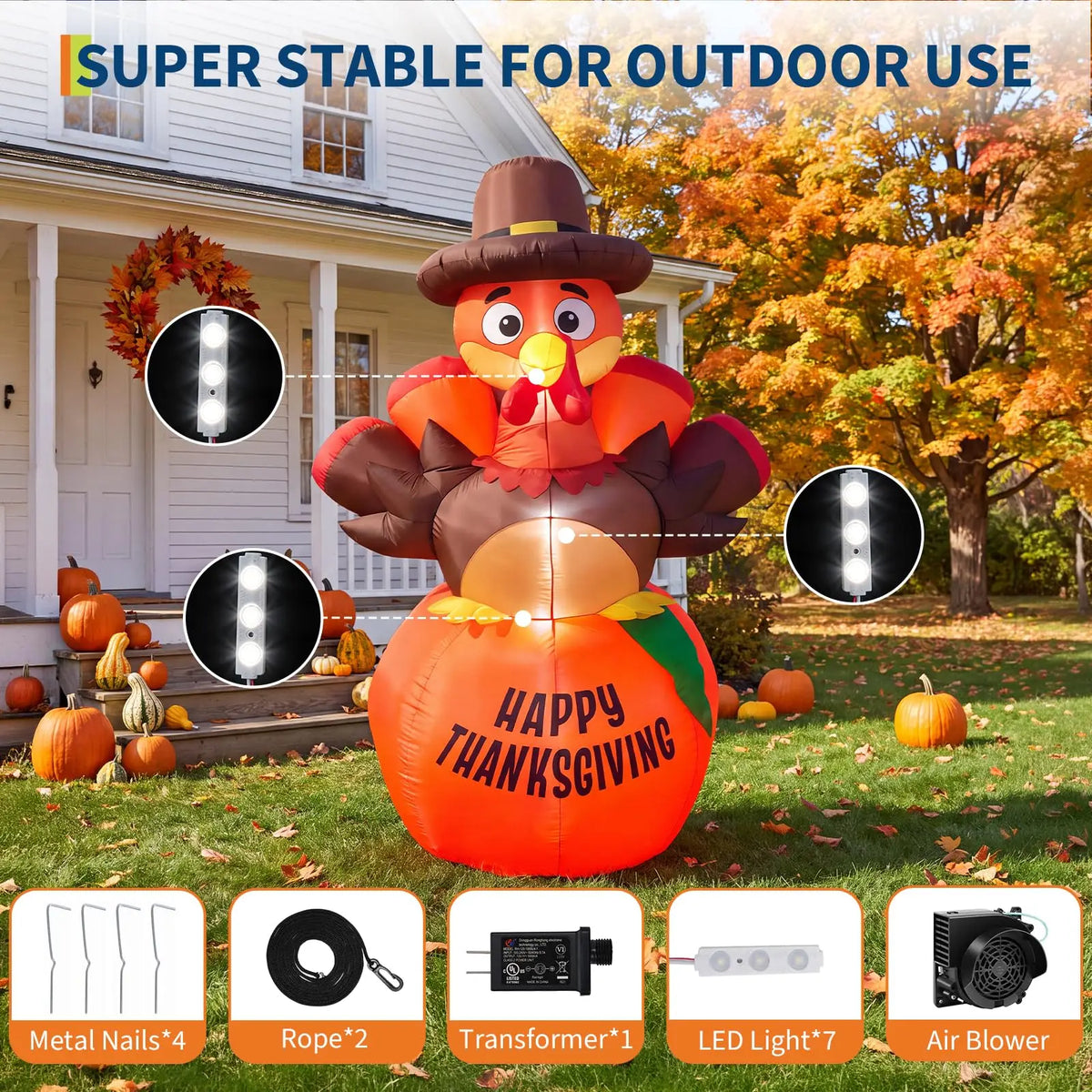 A large orange inflatable pumpkin turkey with LED lights is displayed outdoors in front of a house.