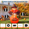 A large orange inflatable pumpkin turkey with LED lights is displayed outdoors in front of a house.