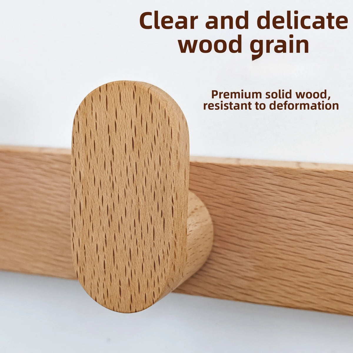 Close-up of clear and delicate wood grain on a solid wood coat rack wall mount.