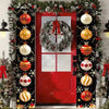 A festive Christmas door banner featuring a red door decorated with garlands, ornaments, and holiday greetings.