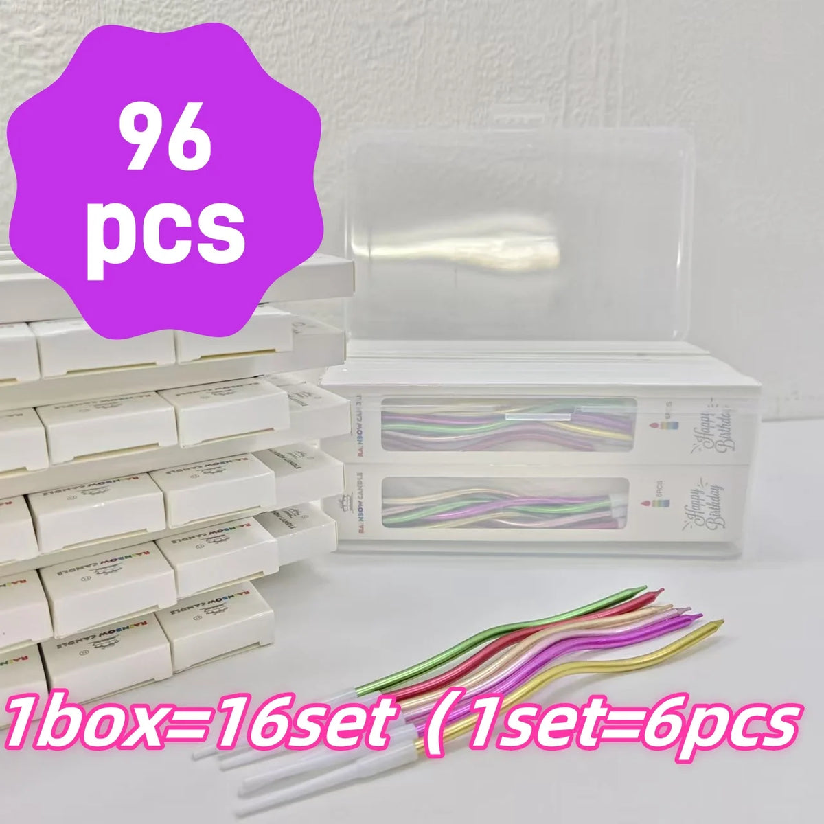 A box of 96 pieces of elegant spiral cake candles, packaged in a clear container and displayed next to stacked white boxes.