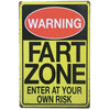 A vintage metal warning sign with a red oval reading WARNING and black text saying FART ZONE and ENTER AT YOUR OWN RISK on a 