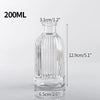 A clear glass vase with ribbed texture, measuring 12.9cm tall and 6.5cm wide.