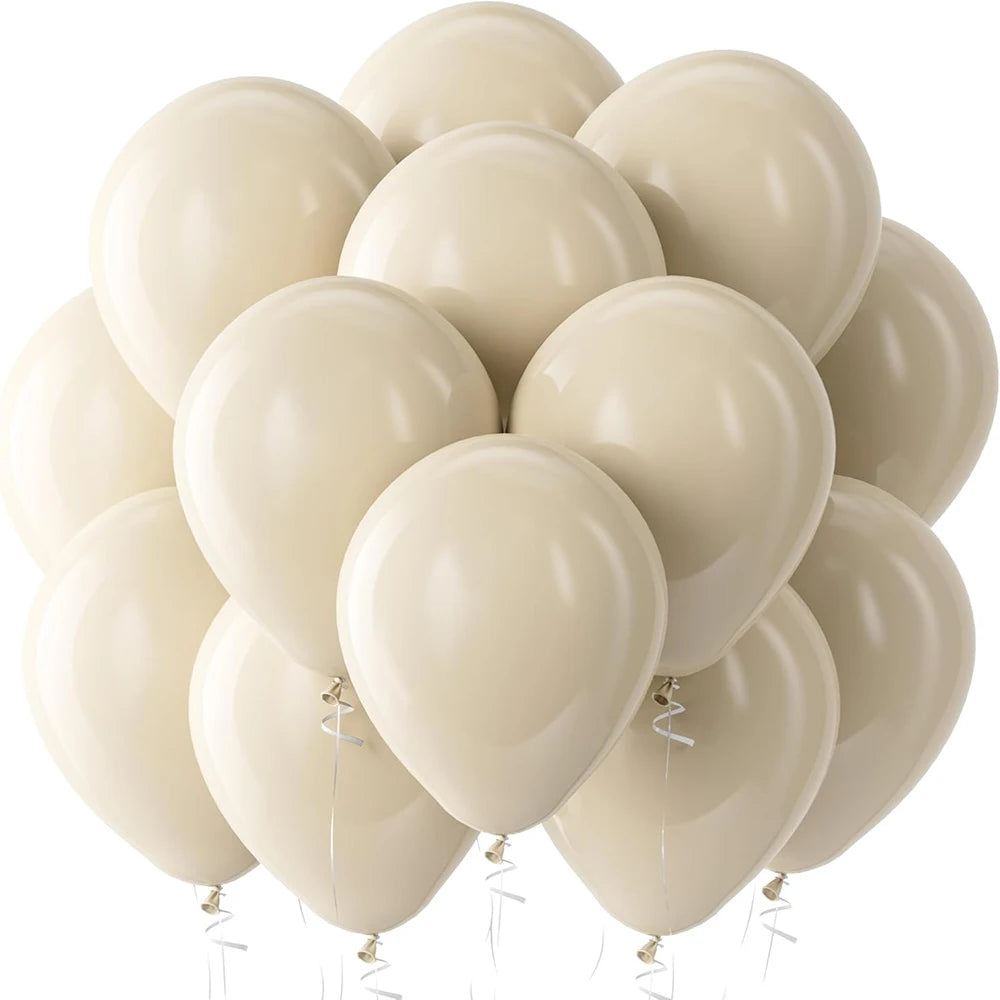 A cluster of cream and beige latex balloons floating against a white background.