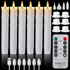 A set of white LED taper candles with a remote control and timer displayed on a white background.