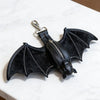 Black faux leather bat wing keychain wallet with a zipper closure