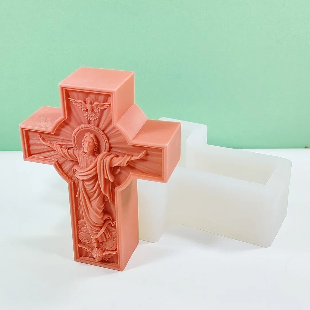 A pink silicone mold shaped like a religious Jesus cross, used for crafting and decorating.