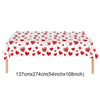 A rectangular table covered with a red heart pattern for a celebration or decoration.
