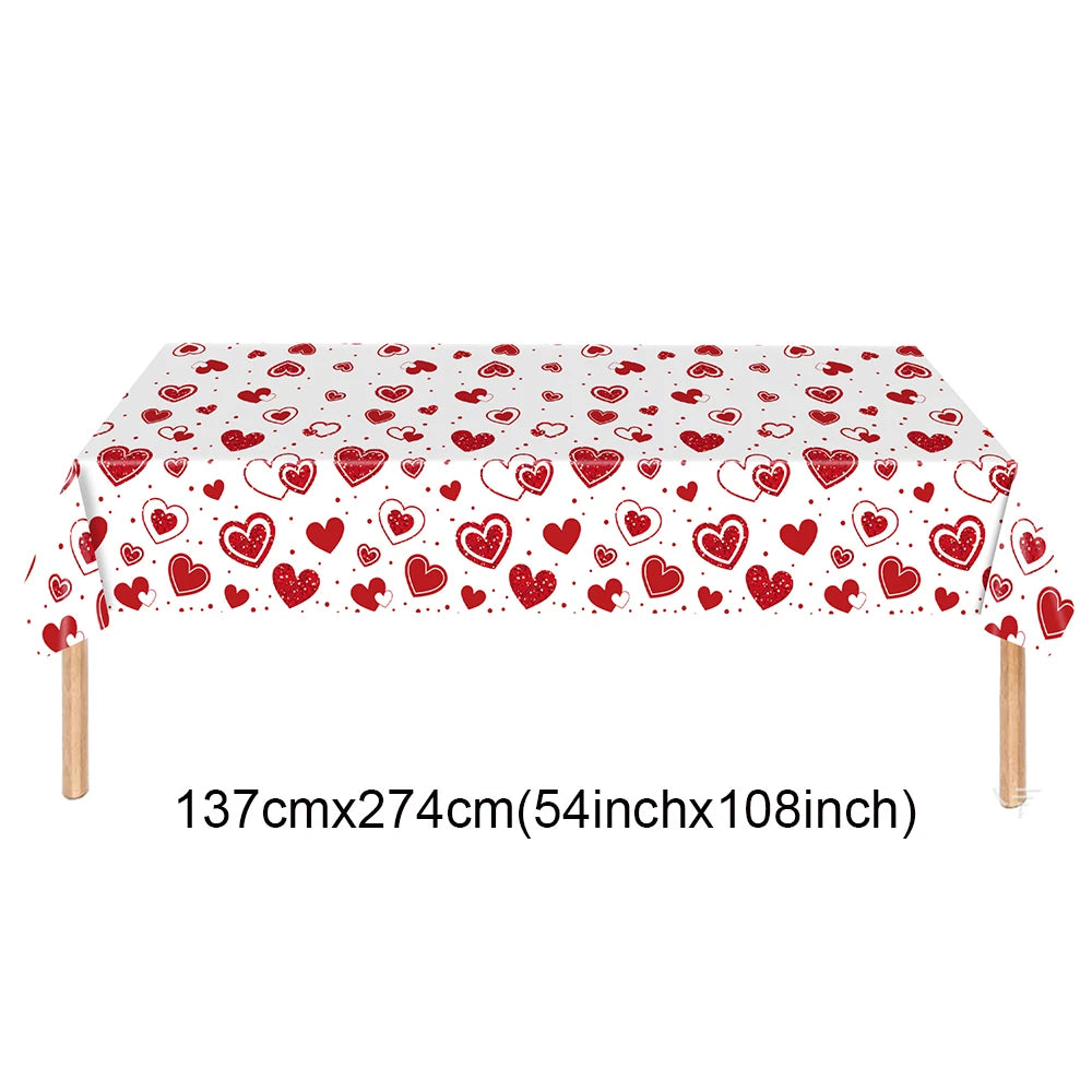 A rectangular table covered with a red heart pattern for a celebration or decoration.