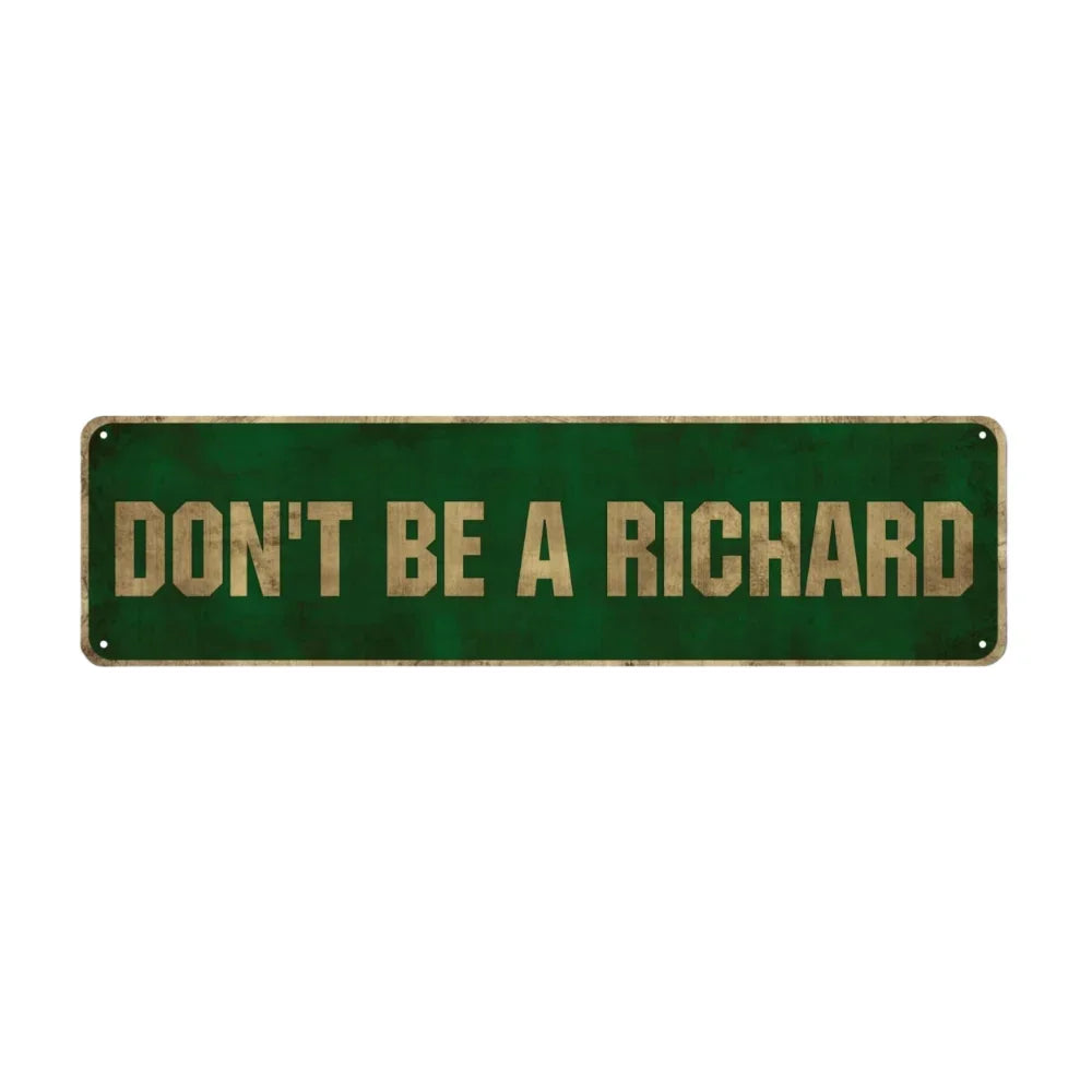 A rectangular, dark green metal sign with the text DON'T BE A RICHARD in gold lettering.