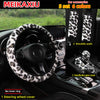 A set of five leopard print car accessories including a steering wheel cover, shoulder pads, and a handbrake gear cover.