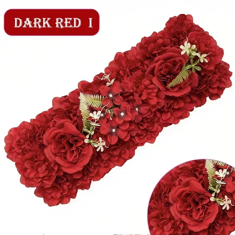 A dense panel of dark red artificial silk roses with green foliage for weddings and events.