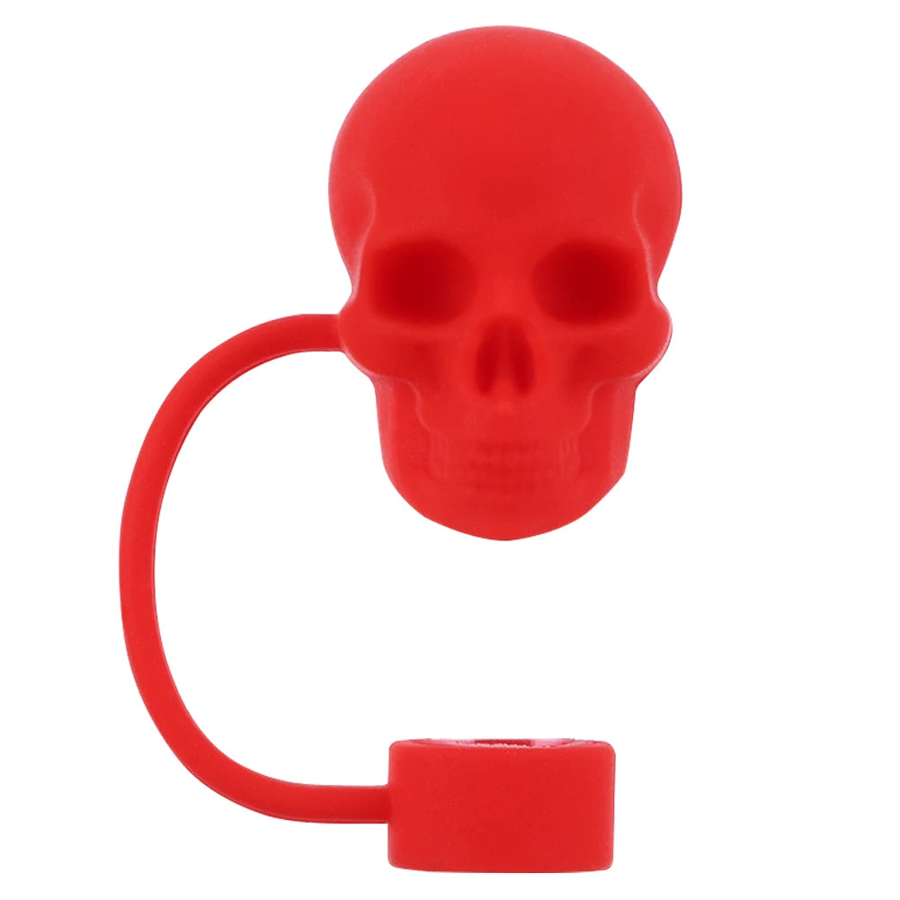 A red reusable silicone straw cover shaped like a skull with a loop and a cap.