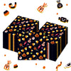 A collection of Halloween themed paper napkins featuring skeletons, spiders, and pumpkins scattered on a white background.