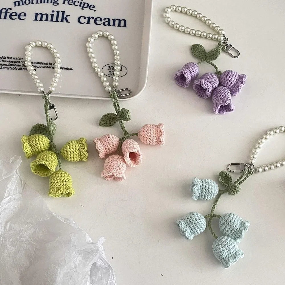 Handmade pearl chain orchid key rings featuring small crocheted flowers in shades of green and pink.