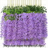 A dense cascade of purple artificial wisteria vine flowers hanging in a green planter.