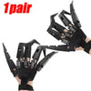 A pair of black articulated skeleton hand gloves shown against a white background.
