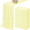 A set of ten terracotta semi-sheer cheesecloth table runners in pale yellow, displayed on a table.