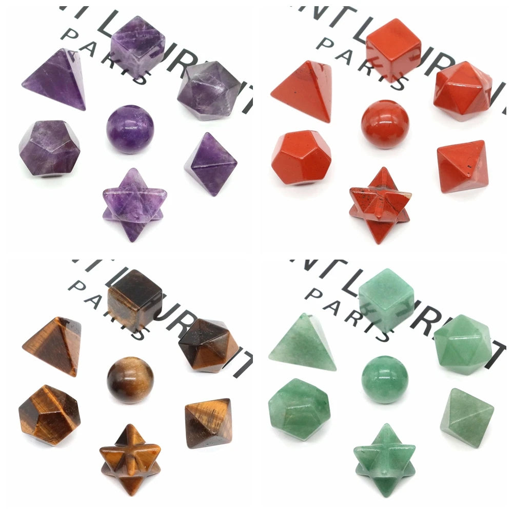 A collection of seven geometric crystals in various colors including purple, red, and green.