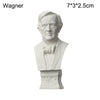A white plaster bust miniature of a man, likely Wagner, featuring classical features and a bow tie.