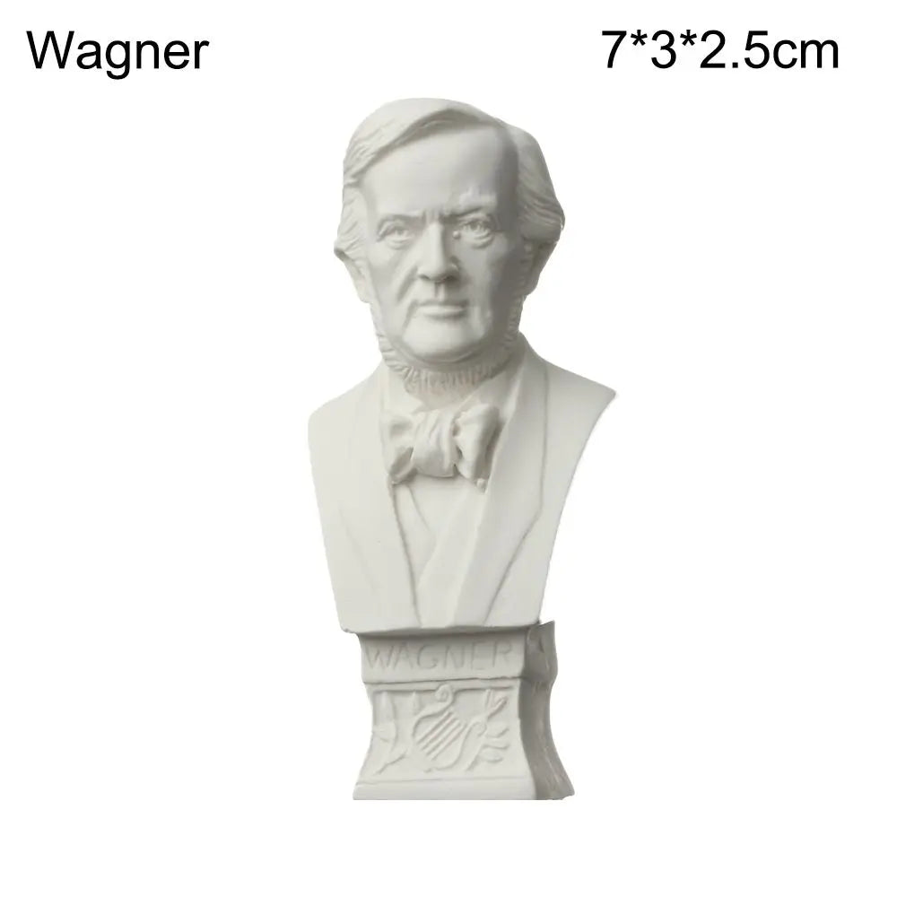 A white plaster bust miniature of a man, likely Wagner, featuring classical features and a bow tie.