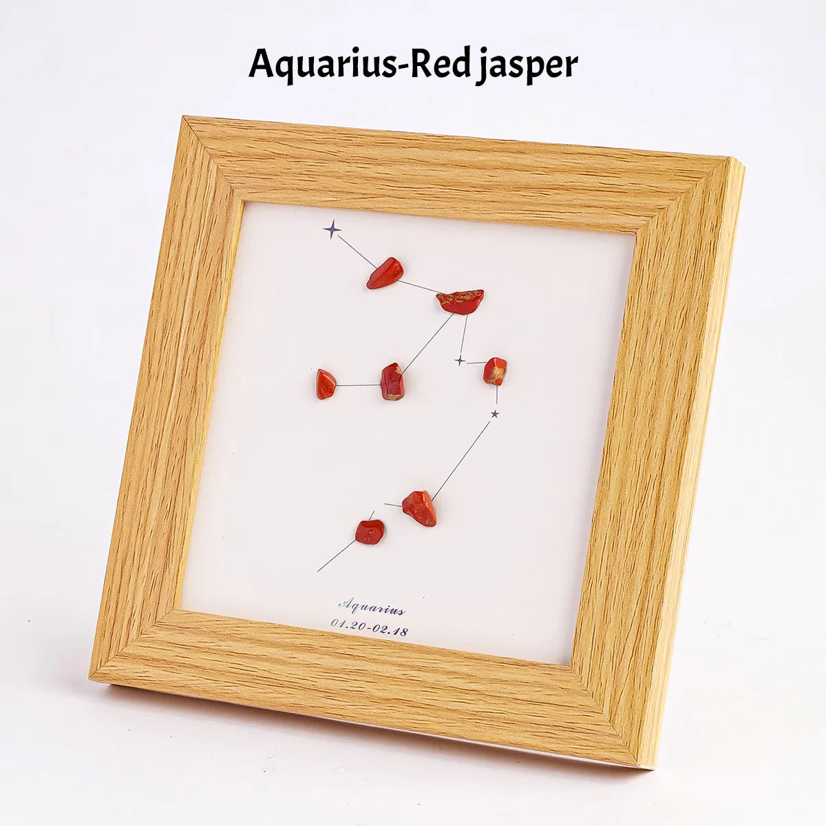 Holzrahmen mit Darstellung des Wassere schenken-Zeichens mit rotem Jasper-Kristallen
