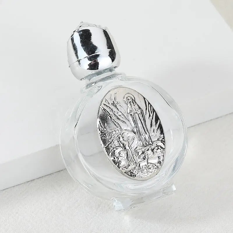 Decorative glass bottle with a silver figurine inside and a twist cap