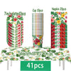 A set of tropical hibiscus tableware including plates, cups, and napkins displayed on a table.