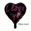 A black heart-shaped balloon with pink text that reads I love you, packaged as a 10-piece pack.