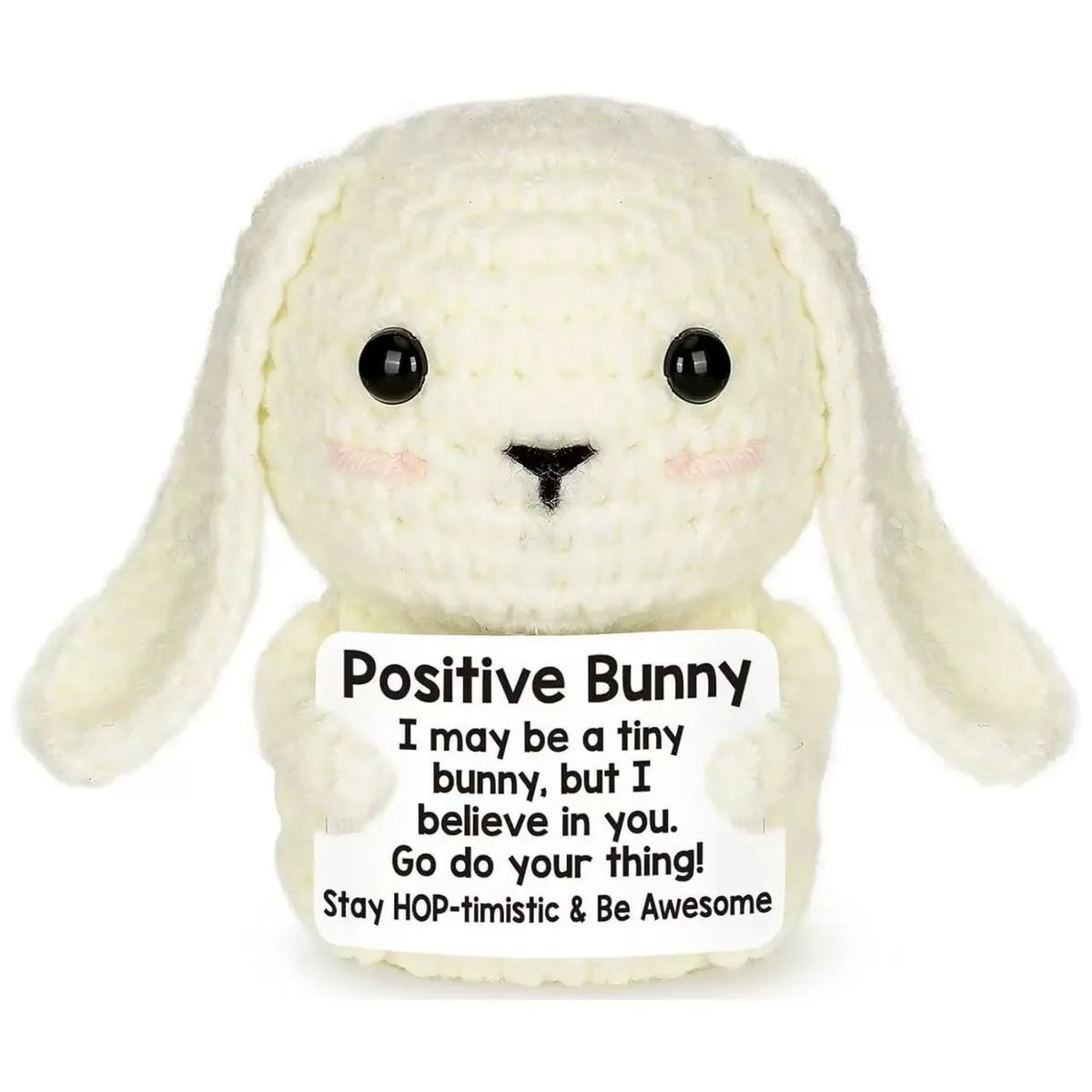 A handmade white crochet bunny doll with long ears and an inspirational card attached.