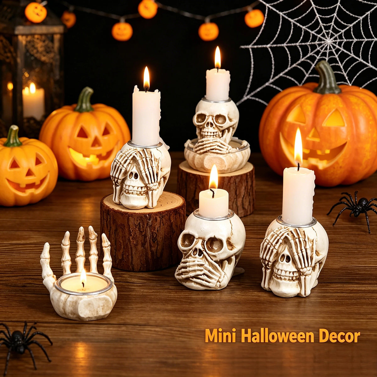 Mini Halloween decor featuring resin skull candle holders and pumpkins with flickering candles.