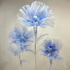 A set of three large, light blue velvet mesh flowers used for wedding decoration.