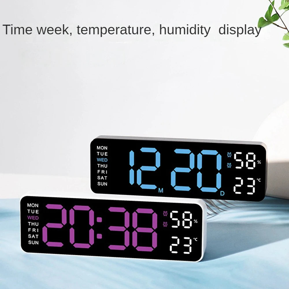 A digital wall clock displaying the time, day of the week, temperature, and humidity on a light blue surface.