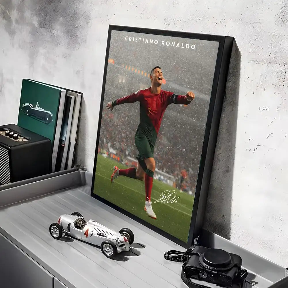 A framed canvas art poster of Cristiano Ronaldo playing football on a green field.