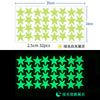 A grid of bright green glow-in-the-dark stars used as wall stickers for kids' rooms.