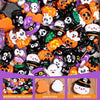 A collection of Halloween resin flatback charms featuring pumpkin and ghost embellishments in various colors.