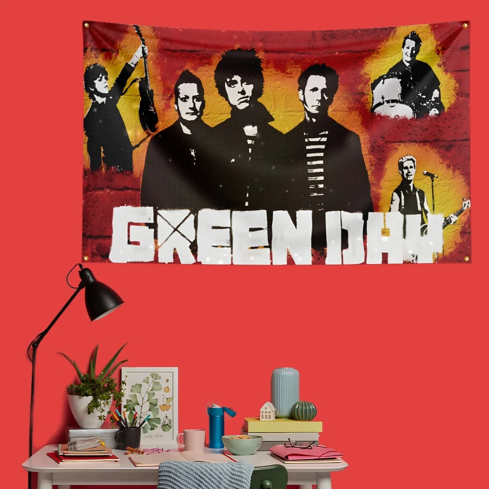 A decorative banner featuring black and white portraits of Green Day members against a fiery red background.