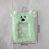 A light green fluffy plush keychain featuring a face and a clear plastic holder for photos.