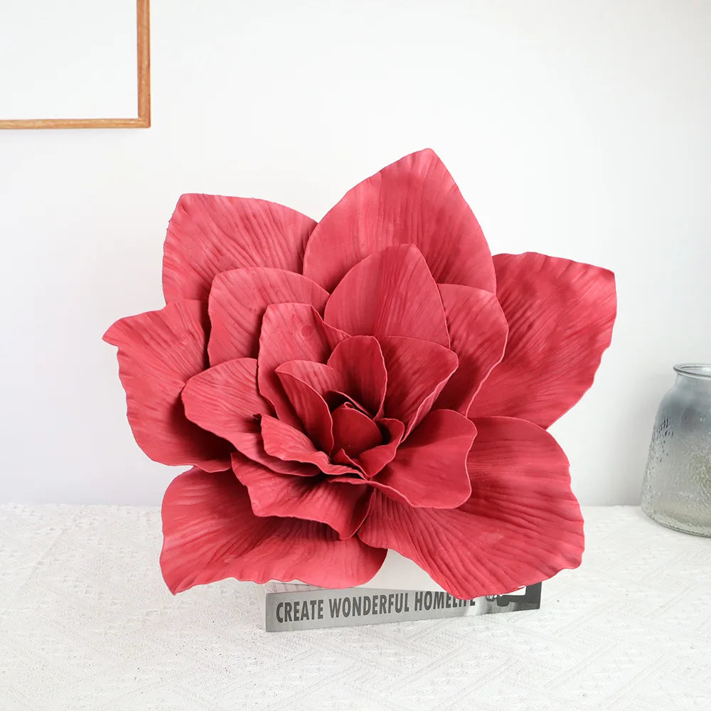 A large, deep red foam rose flower used for wedding and party decor.