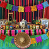Colorful papel picado banners strung across a festive display featuring bright colors and decorative elements.