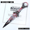 A decorative gothic kunai utility knife with a silver handle and blood-red floral accents.