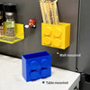 Yellow magnetic wall-mounted kitchen storage rack holding bamboo chopsticks and a blue table-mounted storage box