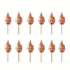 A set of ten personalized baby photo cupcake toppers featuring baby heads on orange paper cones.