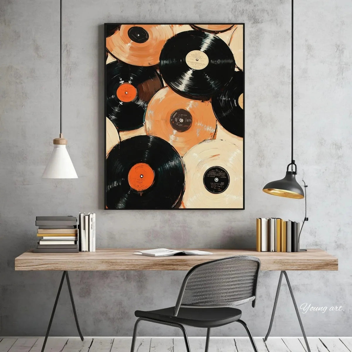 A vertical canvas art print featuring overlapping black and orange vinyl records displayed on a gray wall above a wooden desk