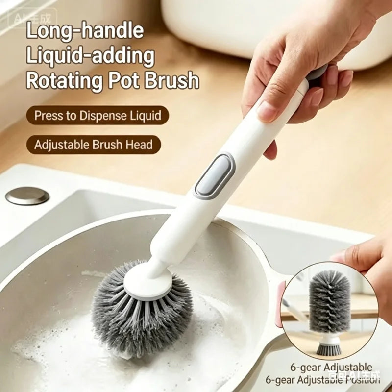 A hand is using a white long-handled liquid-adding rotating pot brush to wash dishes in a sink.