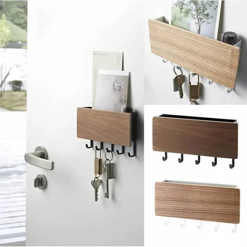 A wall-mounted bamboo key rack with six hooks and a storage shelf is displayed on a white wall.