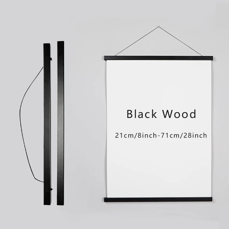 A vertical black magnetic wooden art frame with a white print, shown next to its hanging wire.